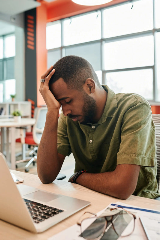 man experiencing stress from caffeine and burnout